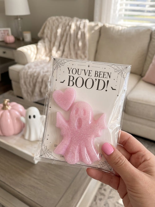 Send a Boo pink glitter resin ghost and matching heart on a You’ve Been Boo’d card, shown in its clear gift sleeve.